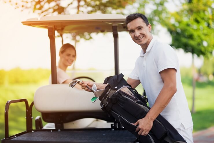 Happy couple golf cart clubs | Joy Ride